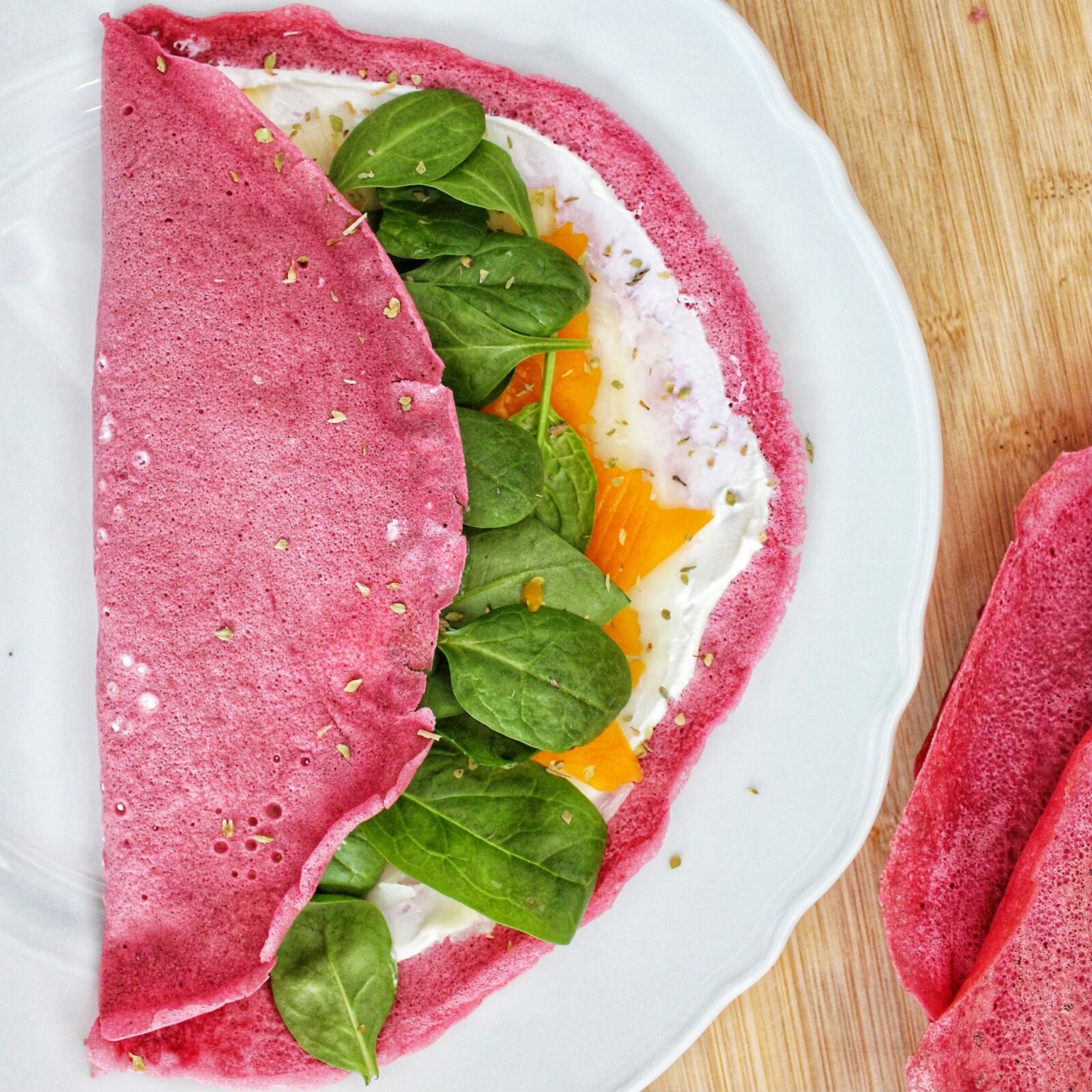 Pink beetroot crepes filed with spinach, squash and sheep's cheese